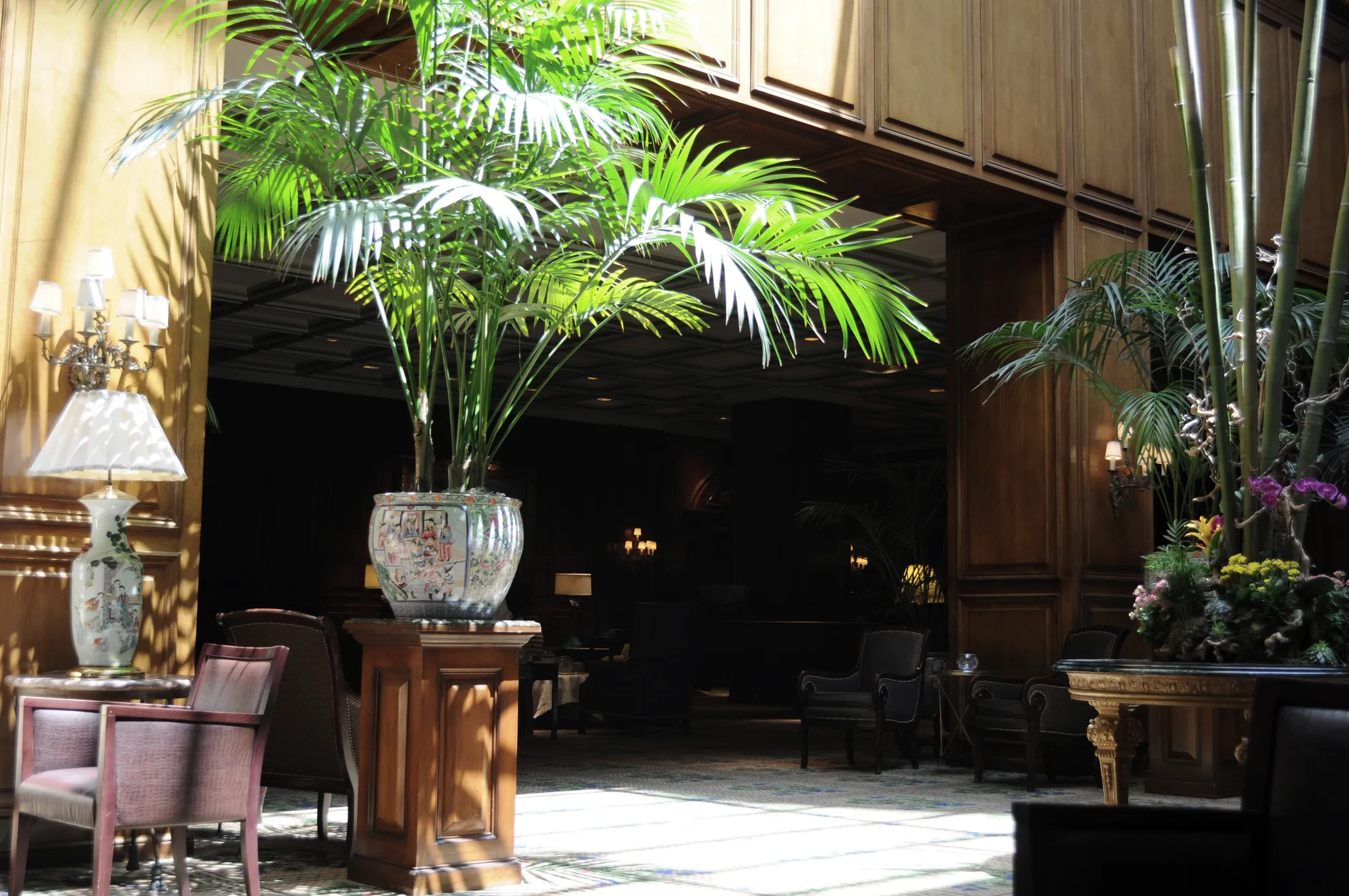 The wood-paneled lobby of a grand historic hotel